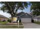 Inviting single-story home with a two-car garage and mature landscaping in a tranquil setting at 4217 Kingbird Ct, Orlando, FL 32826