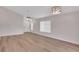 Bright living room showcasing light wood flooring and modern lighting fixtures at 4217 Kingbird Ct, Orlando, FL 32826