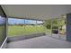 Enclosed patio with views of the backyard at 4217 Kingbird Ct, Orlando, FL 32826