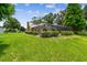 The home is surrounded by a well-maintained green yard, creating a picturesque backdrop at 4221 Meadowbend Ct, Lakeland, FL 33811