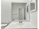 This bathroom features a sink vanity with large mirror and toilet at 4221 Meadowbend Ct, Lakeland, FL 33811