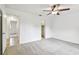 Spacious bedroom with walk-in closet, tile access to another room, and ceiling fan at 4221 Meadowbend Ct, Lakeland, FL 33811