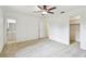 Spacious bedroom with two doorways, a walk-in closet, and a ceiling fan at 4221 Meadowbend Ct, Lakeland, FL 33811