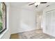 Bright bedroom with neutral carpet, ceiling fan and double-door closet at 4221 Meadowbend Ct, Lakeland, FL 33811