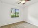 Light-filled bedroom with neutral carpet and a street view at 4221 Meadowbend Ct, Lakeland, FL 33811