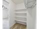 Walk-in closet featuring built-in shelving units at 4221 Meadowbend Ct, Lakeland, FL 33811