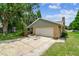 Well maintained single-story home with a two-car garage and long concrete driveway at 4221 Meadowbend Ct, Lakeland, FL 33811