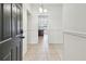View of the foyer with neutral tile flooring, looking into the adjacent rooms at 4221 Meadowbend Ct, Lakeland, FL 33811