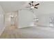 Bright living room showcasing a ceiling fan and access to other areas at 4221 Meadowbend Ct, Lakeland, FL 33811