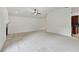Open living room with stone fireplace and views into the kitchen and hallway at 4221 Meadowbend Ct, Lakeland, FL 33811