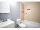 Bathroom with a tiled shower/tub and a white vanity at 1920 E Edgewood Dr # E1, Lakeland, FL 33803