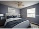 Well-lit bedroom with a large window, carpeted flooring, and comfortable queen bed at 1920 E Edgewood Dr # E1, Lakeland, FL 33803
