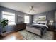 Stylishly furnished bedroom with a calm color palette and hardwood floors at 1920 E Edgewood Dr # E1, Lakeland, FL 33803