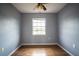 Unfurnished bedroom with hardwood floors, ceiling fan, and natural light at 1920 E Edgewood Dr # E1, Lakeland, FL 33803
