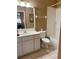 Bathroom featuring a vanity, a toilet, and a tiled shower at 314 Lake Butler Dr, Kissimmee, FL 34759