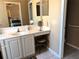 Bathroom featuring white vanity, sink, and a makeup station with stool at 314 Lake Butler Dr, Kissimmee, FL 34759