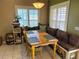 Cozy dining nook with a built-in bench, corner windows, and ample seating at 314 Lake Butler Dr, Kissimmee, FL 34759