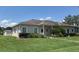 Attractive single-story home with a lush lawn and carefully manicured landscaping at 314 Lake Butler Dr, Kissimmee, FL 34759