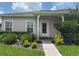 Inviting single-story home with brick walkway, lush greenery and great curb appeal at 314 Lake Butler Dr, Kissimmee, FL 34759