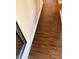 Hallway with wood flooring and baseboards at 314 Lake Butler Dr, Kissimmee, FL 34759