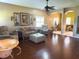 Spacious living room boasting hardwood floors, ceiling fan, and archway to other rooms at 314 Lake Butler Dr, Kissimmee, FL 34759