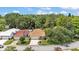 Aerial view showcasing a well-maintained home on a large lot with mature trees at 454 San Jose Dr, Winter Haven, FL 33884