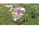 Aerial view of single-Gathering homes with lush trees providing a private backyard retreat at 454 San Jose Dr, Winter Haven, FL 33884