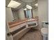 Bathroom featuring a vanity with ample storage and an illuminated mirror at 454 San Jose Dr, Winter Haven, FL 33884