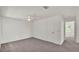 Clean, neutral bedroom with ceiling fan and access to closet at 454 San Jose Dr, Winter Haven, FL 33884