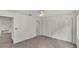 Bedroom with ceiling fan, neutral carpet, and plenty of closet space at 454 San Jose Dr, Winter Haven, FL 33884