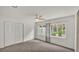 Bright bedroom featuring carpet, closet, and large windows at 454 San Jose Dr, Winter Haven, FL 33884