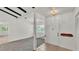 Bright entryway with tile flooring and view into the living room at 454 San Jose Dr, Winter Haven, FL 33884