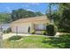 Charming single-story home with a well-maintained lawn, neutral paint and tile roof at 454 San Jose Dr, Winter Haven, FL 33884