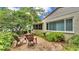 Landscaped backyard and patio seating add charm to this home's exterior at 454 San Jose Dr, Winter Haven, FL 33884