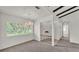 Bright living room featuring elegant lighting, carpet, and staircase at 454 San Jose Dr, Winter Haven, FL 33884