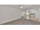 Comfortable living room featuring neutral decor, ceiling fan, and views to outside at 454 San Jose Dr, Winter Haven, FL 33884