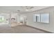 Bright living room featuring neutral decor and a ceiling fan at 454 San Jose Dr, Winter Haven, FL 33884