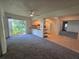 Combined living and dining area, showcasing easy access to the patio and kitchen at 454 San Jose Dr, Winter Haven, FL 33884
