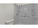 Accessible tiled shower with grab bar and shower seat at 454 San Jose Dr, Winter Haven, FL 33884