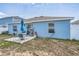 Inviting backyard featuring a cozy patio area, perfect for outdoor relaxation and entertaining at 621 Silver Palm Dr, Haines City, FL 33844