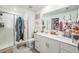 Bright bathroom featuring double sinks, granite countertops, and a glass-enclosed shower for a spa-like experience at 621 Silver Palm Dr, Haines City, FL 33844