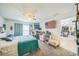 Primary bedroom with large bed, comfortable sitting chair and lots of natural light at 621 Silver Palm Dr, Haines City, FL 33844