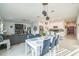 Dining and living rooms offer open concept living with neutral colors, decor, and plenty of natural light at 621 Silver Palm Dr, Haines City, FL 33844