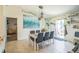 Bright dining room features a table with seating for six and sliding glass doors to the outdoor space at 621 Silver Palm Dr, Haines City, FL 33844