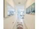 Inviting hallway with unique décor and a view into the spacious living and dining area at 621 Silver Palm Dr, Haines City, FL 33844