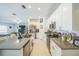 Gourmet kitchen featuring stainless steel appliances, granite counters, and a spacious living area at 621 Silver Palm Dr, Haines City, FL 33844