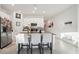 Bright and airy kitchen with a center island, stainless steel appliances, and casual seating at 621 Silver Palm Dr, Haines City, FL 33844