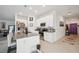 Bright kitchen showcases an island with a seating area, stainless steel appliances, and ample counter space at 621 Silver Palm Dr, Haines City, FL 33844