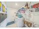 Laundry room featuring washer and dryer with shelving for organizing at 621 Silver Palm Dr, Haines City, FL 33844