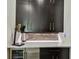Stylish bar area features dark wood cabinets and white countertop at 12684 Willstatter Ave, Orlando, FL 32827